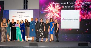 Bristol Myers Squibb on stage with Louise Minchin and The Rt Hon Caroline Nokes MP after winning The Menopause Friendly Employer of the Year Award 2022