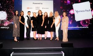 Team on stage at The Menopause Friendly Employer Awards 2022