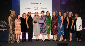 Santander, Winners of Most Supportive Partner on stage with Louise Minchin at The Menopause Friendly Employer Awards 2022