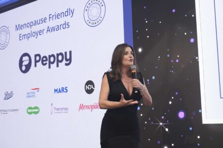 Deborah Garlick on stage at The Menopause Friendly Employer Awards 2024 Deborah Garlick on stage at The Menopause Friendly Employer Awards 2024